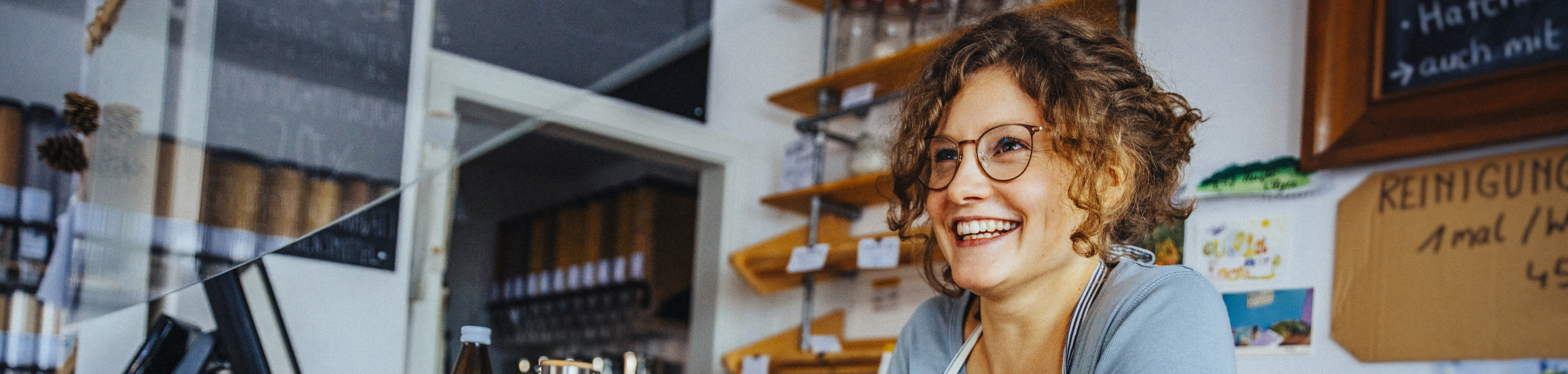 A happy female barista herobig