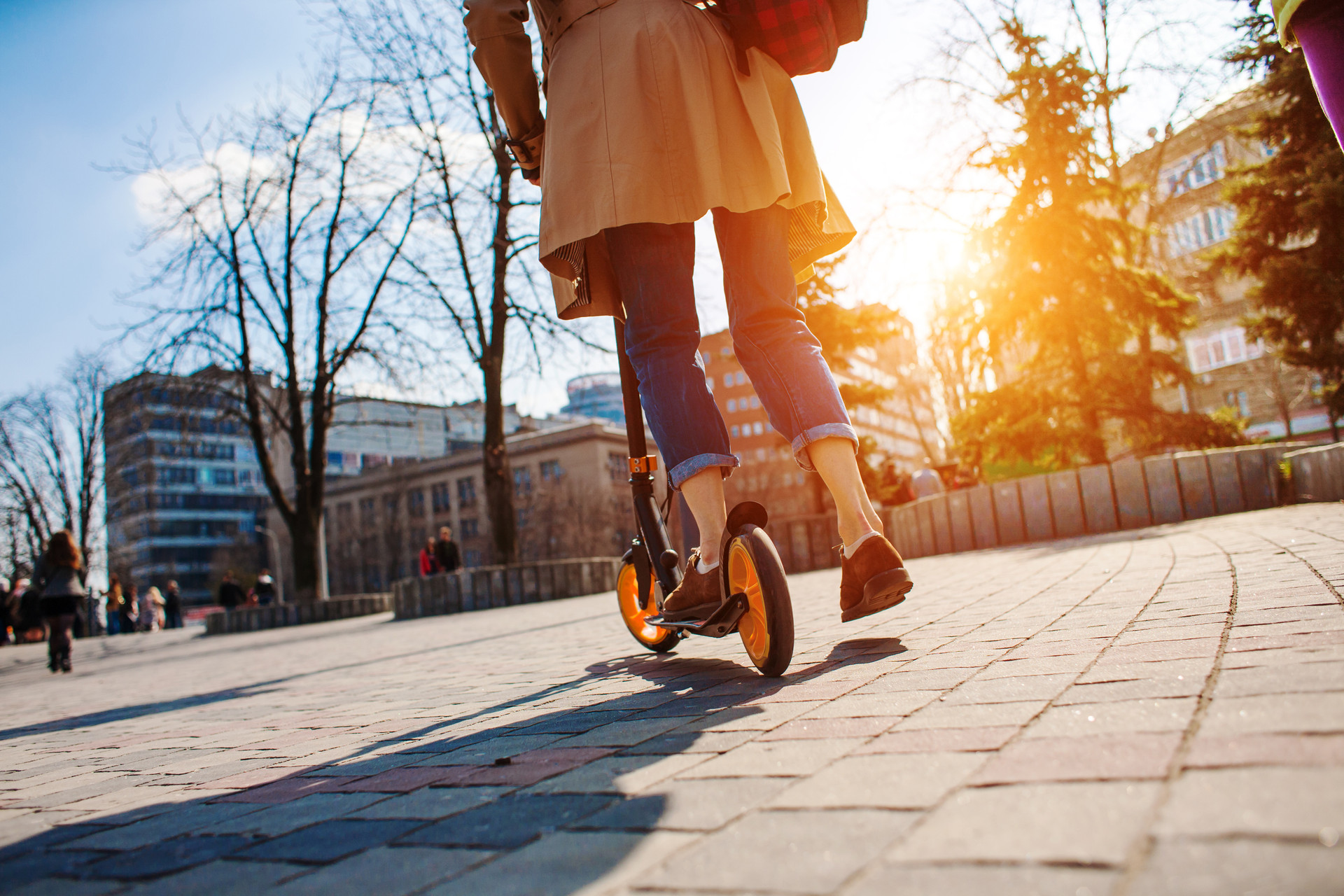 Girl is riding her electric scooter