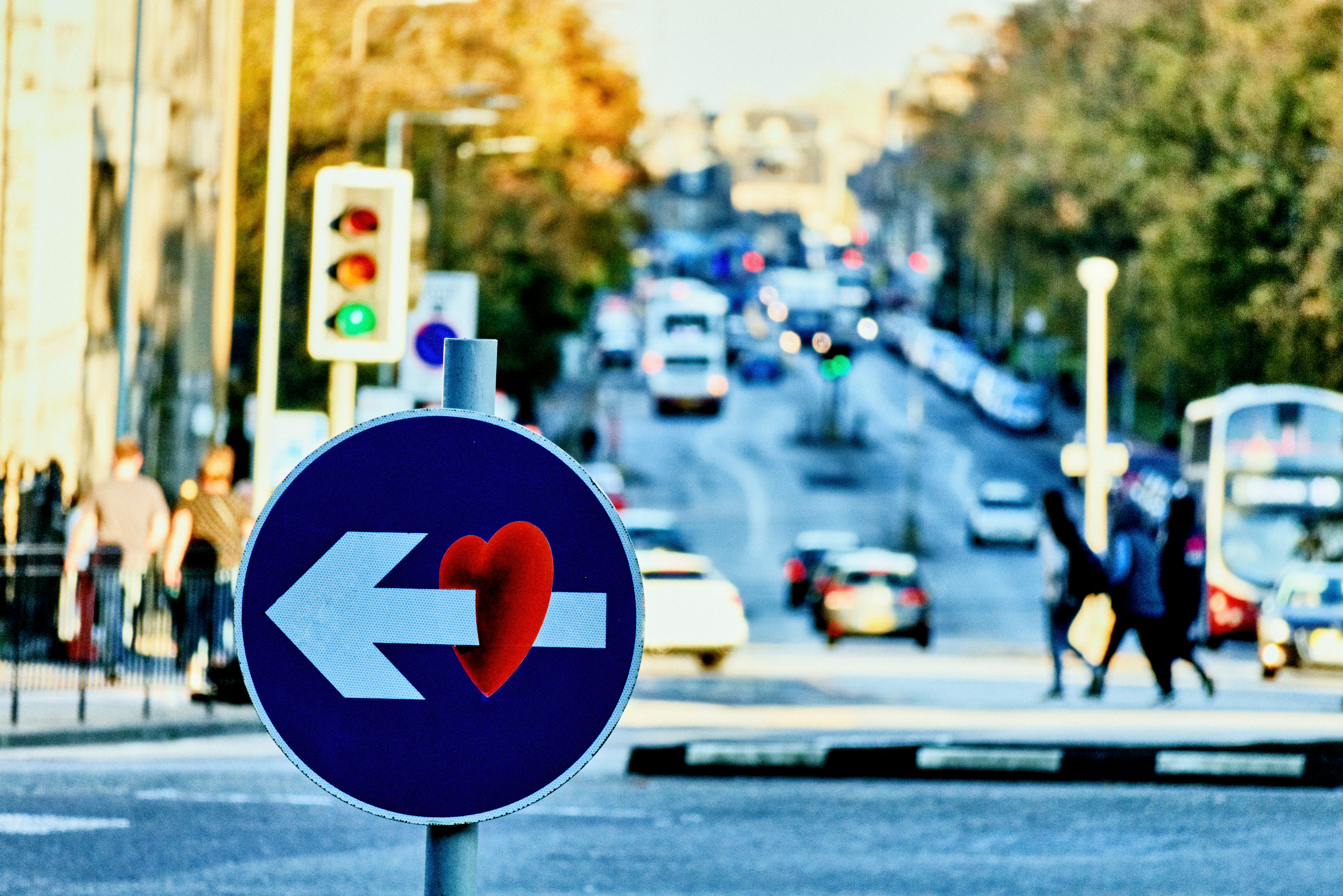 Street sign with graffiti art of heart