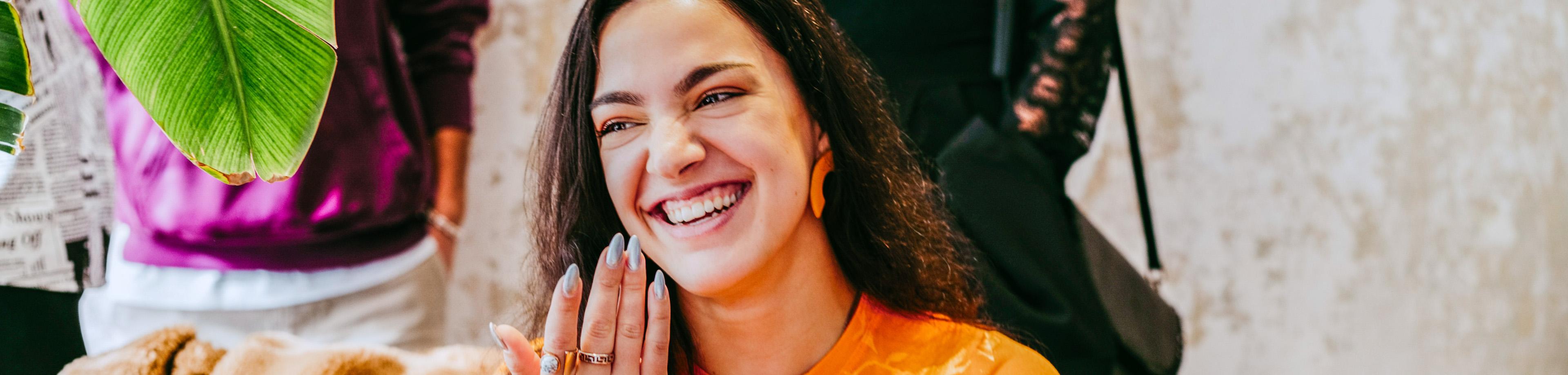 Young smiling businesswoman at networking event